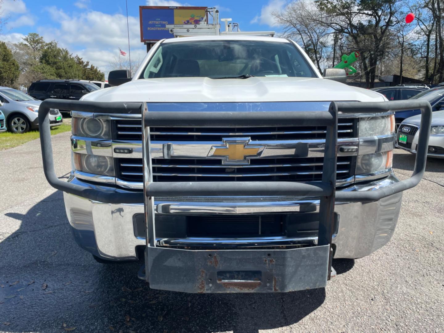 2015 WHITE CHEVROLET SILVERADO 2500H WORK TRUCK (1GC1KUEG7FF) with an 6.0L engine, Automatic transmission, located at 5103 Dorchester Rd., Charleston, SC, 29418-5607, (843) 767-1122, 36.245171, -115.228050 - Local Trade-in with Easy Clean Vinyl Interior, Backup Camera, AM/FM/AUX, Spacious Rear Seat, Power Windows, Power Locks, Power Mirrors, Utility Cab with Storage All Around, Pull Out Bed Storage, Ladder Rack, Safety Strobe Lights, Keyless Entry, Tow Package with Brake Assist, 4-Wheel Drive, Brush Gua - Photo#1